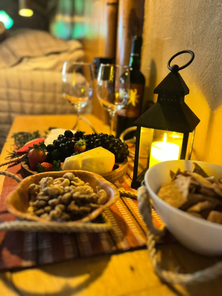 Welcome table with wine, fruit and cheese